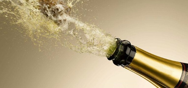 bottle of champagne popping open